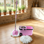 A person effortlessly cleaning a floor with the Quick Spin Mop.