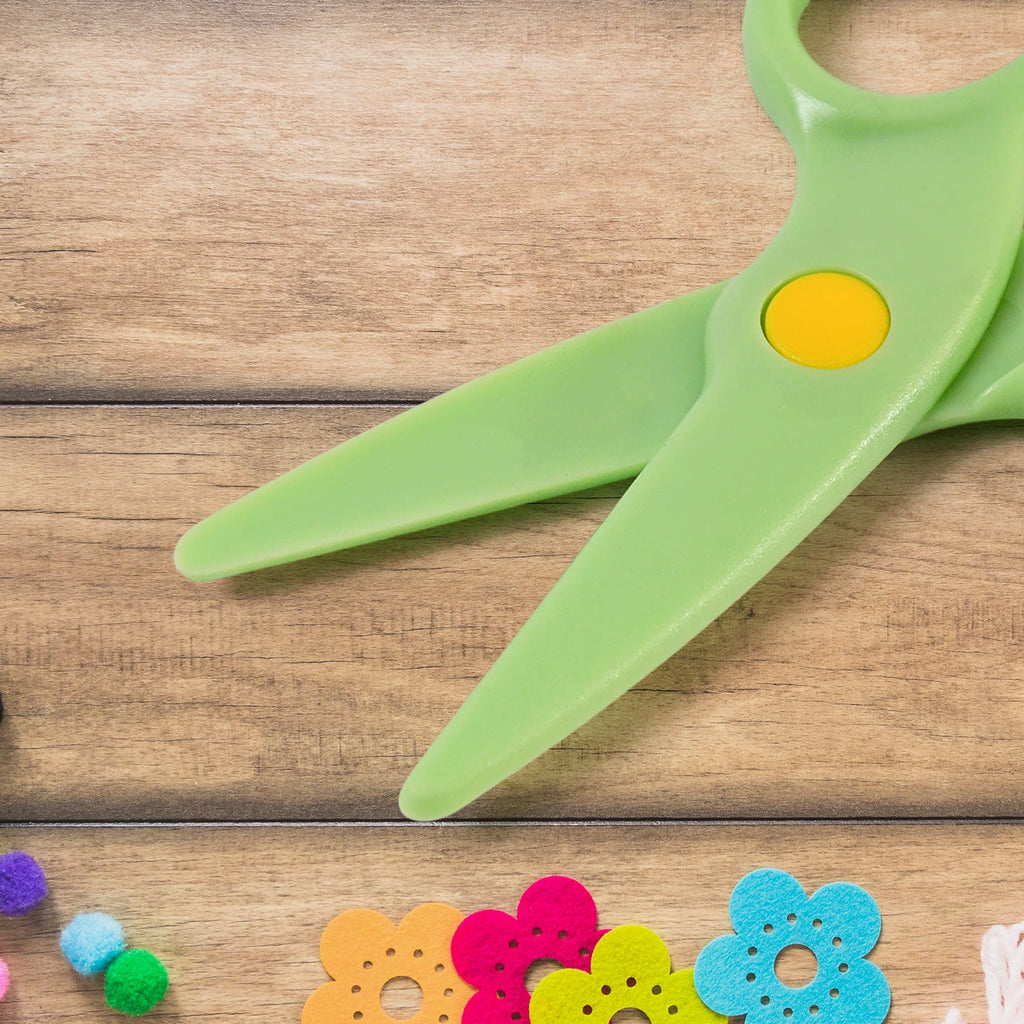 Close-up of plastic safety scissors blades with rounded tips for safe cutting