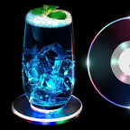 Round LED cocktail coaster switched on, displaying festive colorful lights.