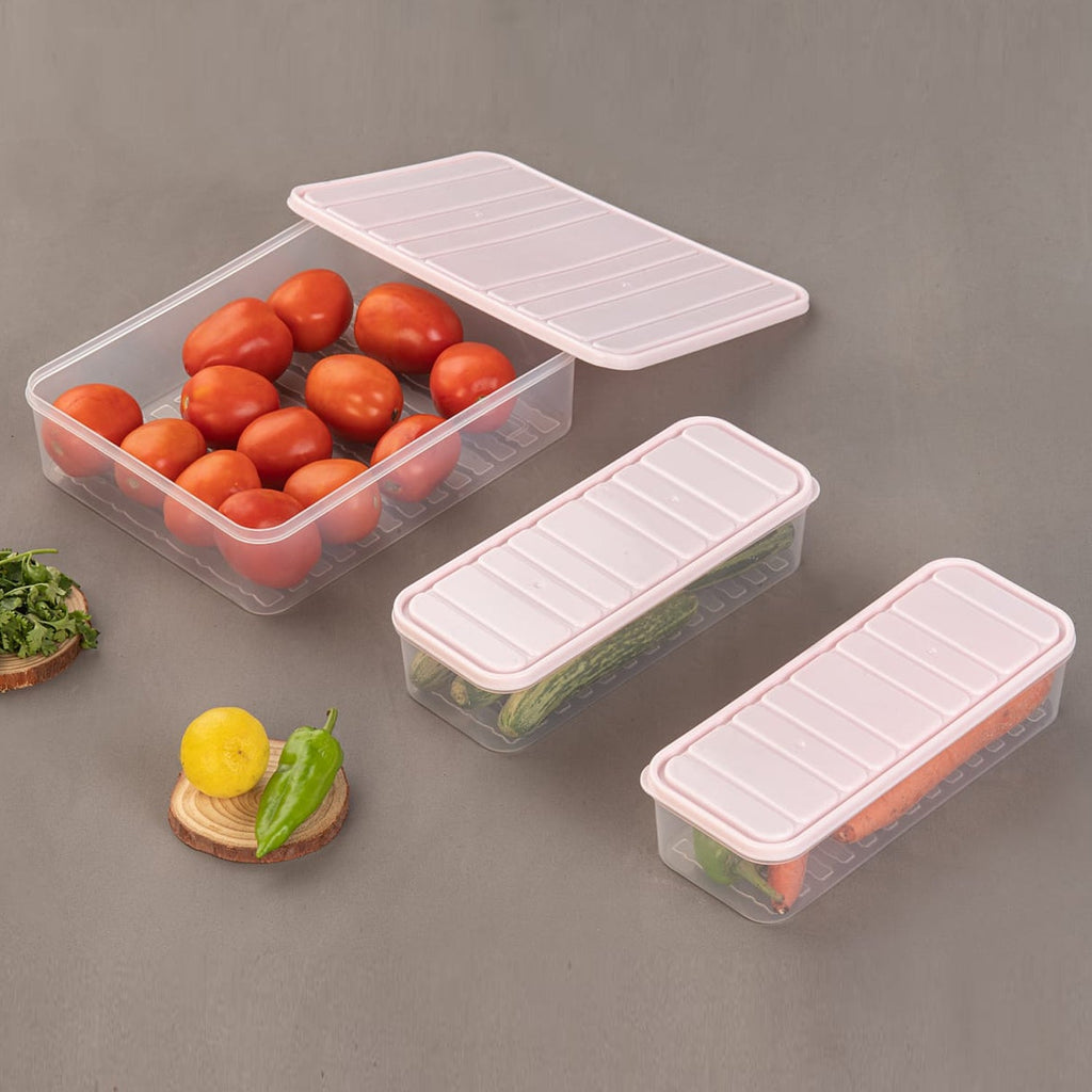 Three clear plastic food storage containers with blue lids, showcasing their stackable design on a kitchen counter.