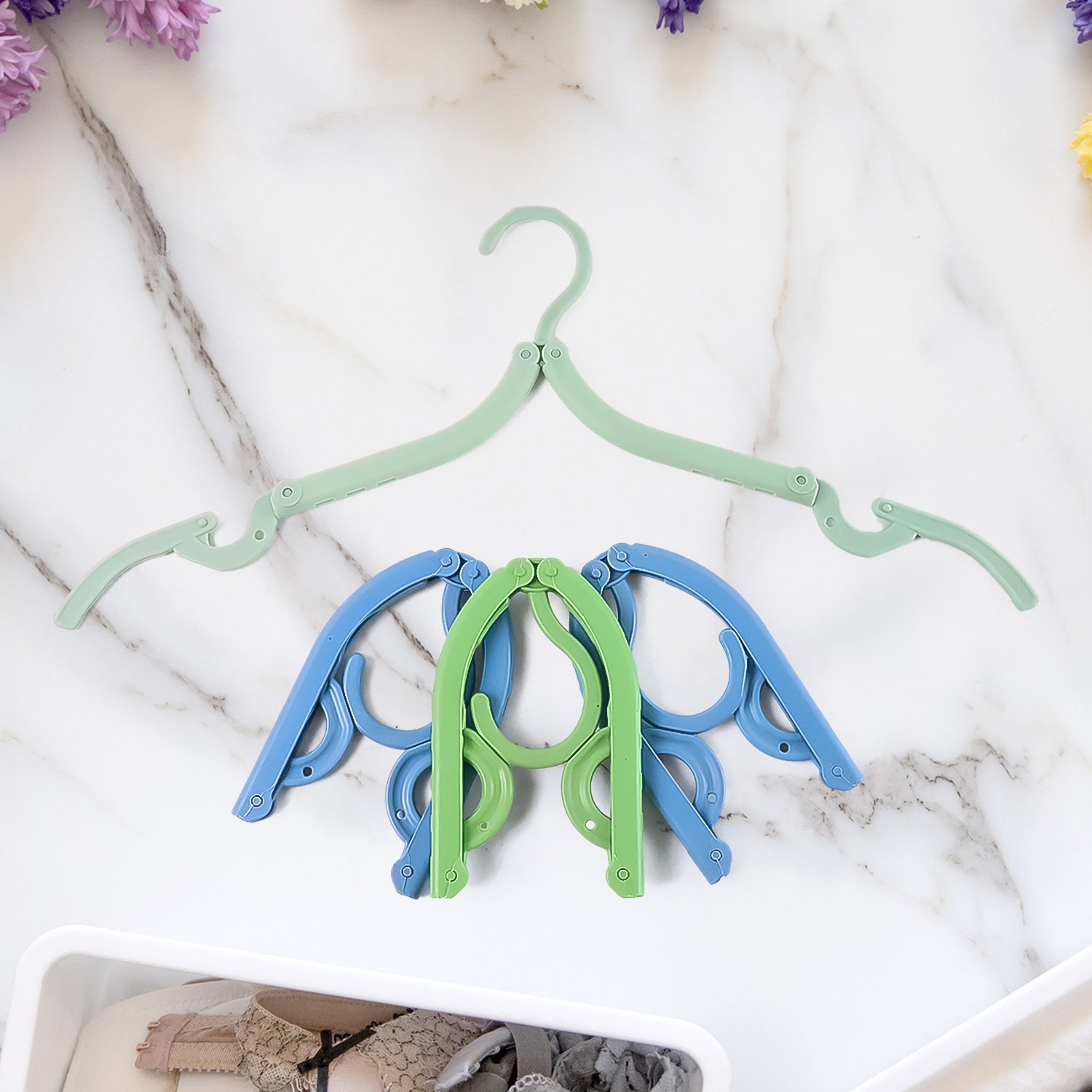 Folded lightweight compact travel hanger ready for packing