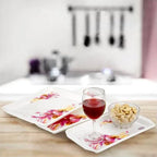 Multicolor serving trays set including small, medium, and large sizes for flexible use.