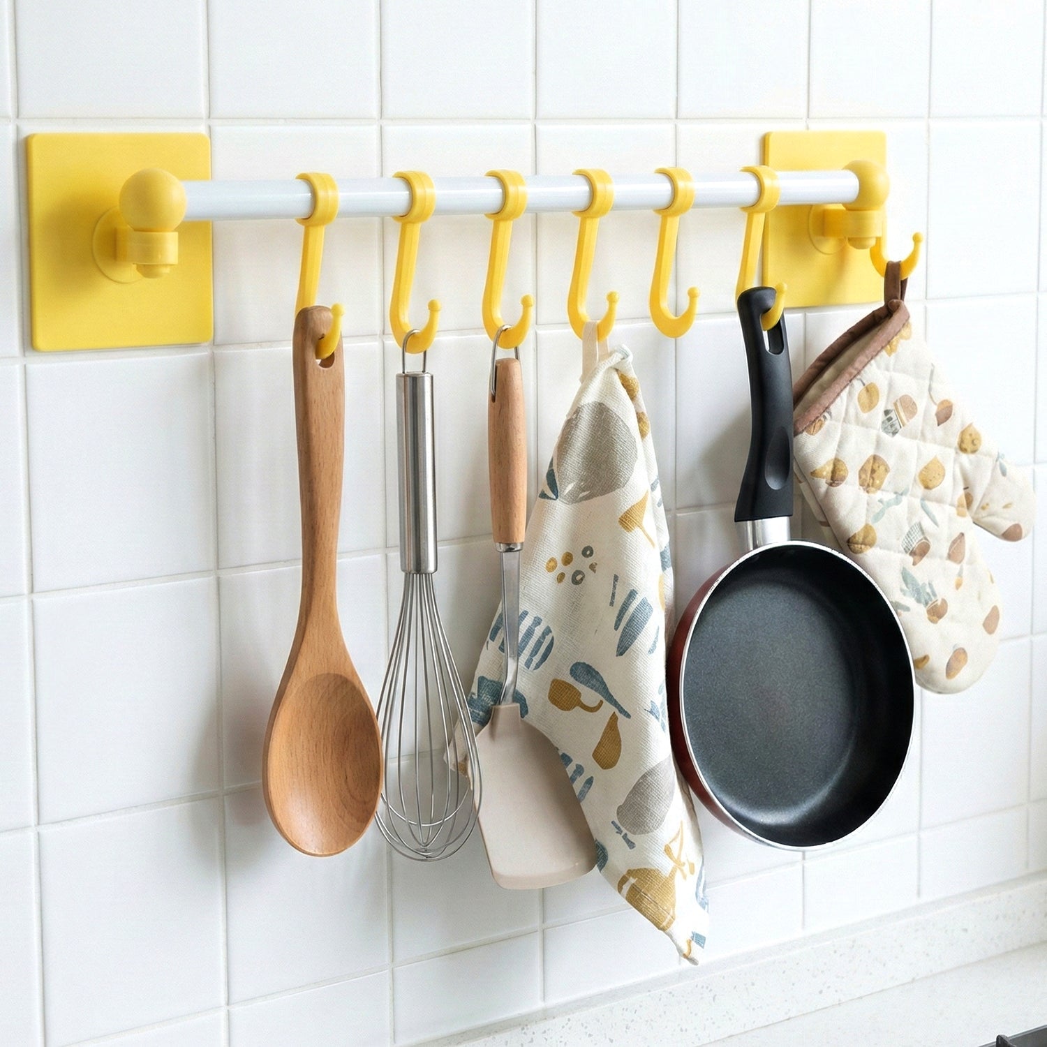 Kitchen utility organizer wall rack featuring strong adhesive mount and hooks