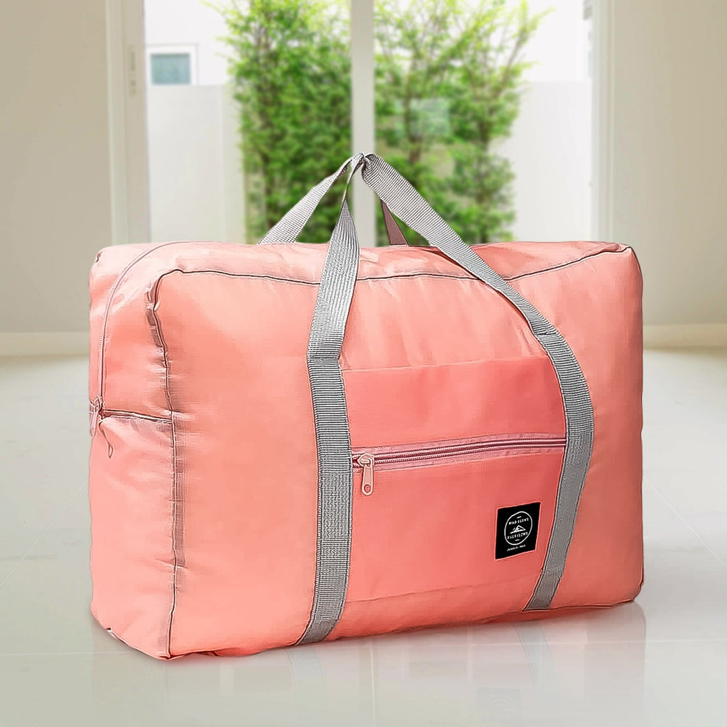 Person carrying the lightweight blue Foldable Travel Bag over their shoulder.