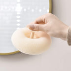 Ergonomic design of the flower bath sponge showing its easy-grip handle.