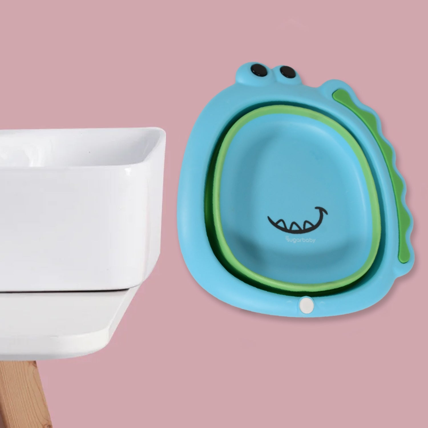 The versatile foldable baby wash basin holding fresh fruits and vegetables for cleaning.