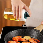 Transparent glass oil storage bottle with a flexible silicone applicator brush.