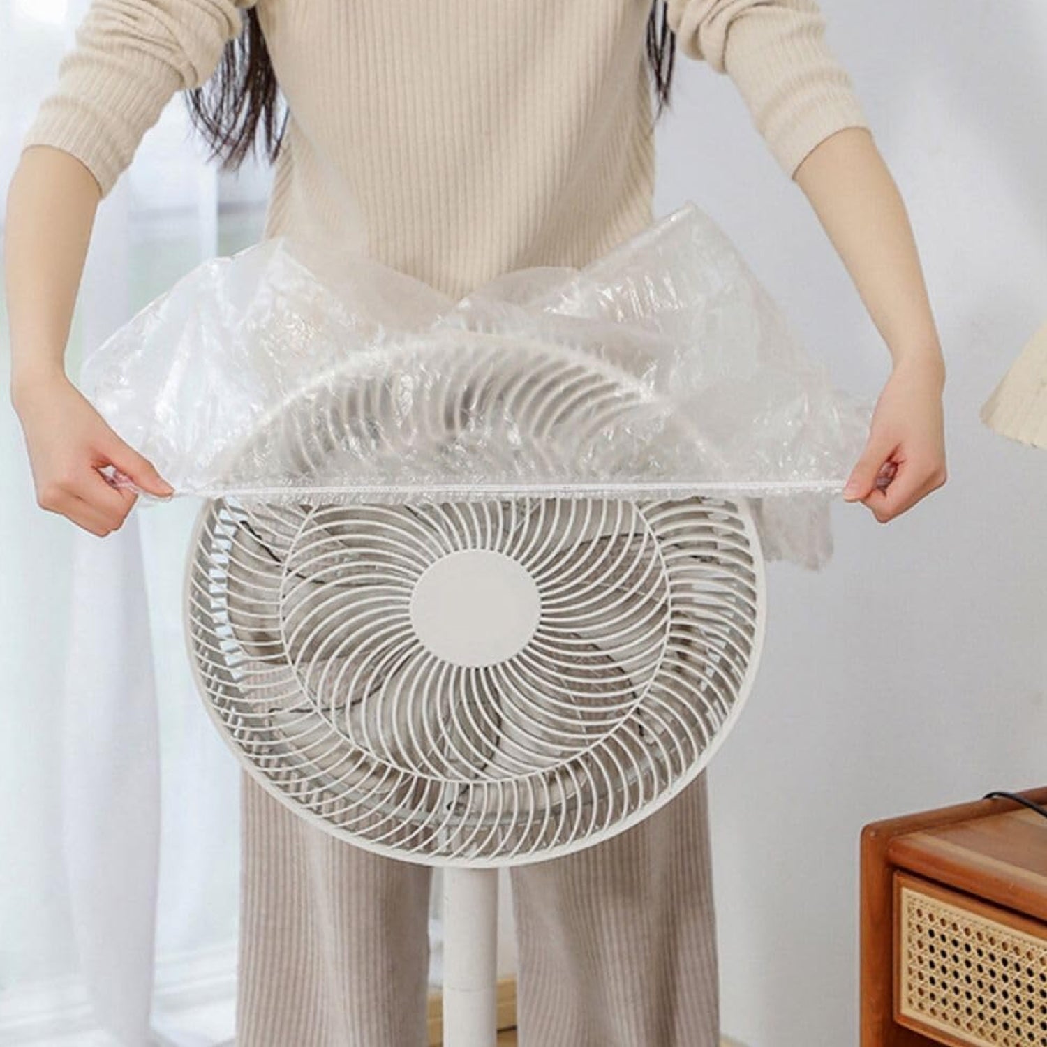 Thick plastic armchair covers providing robust protection from dust.