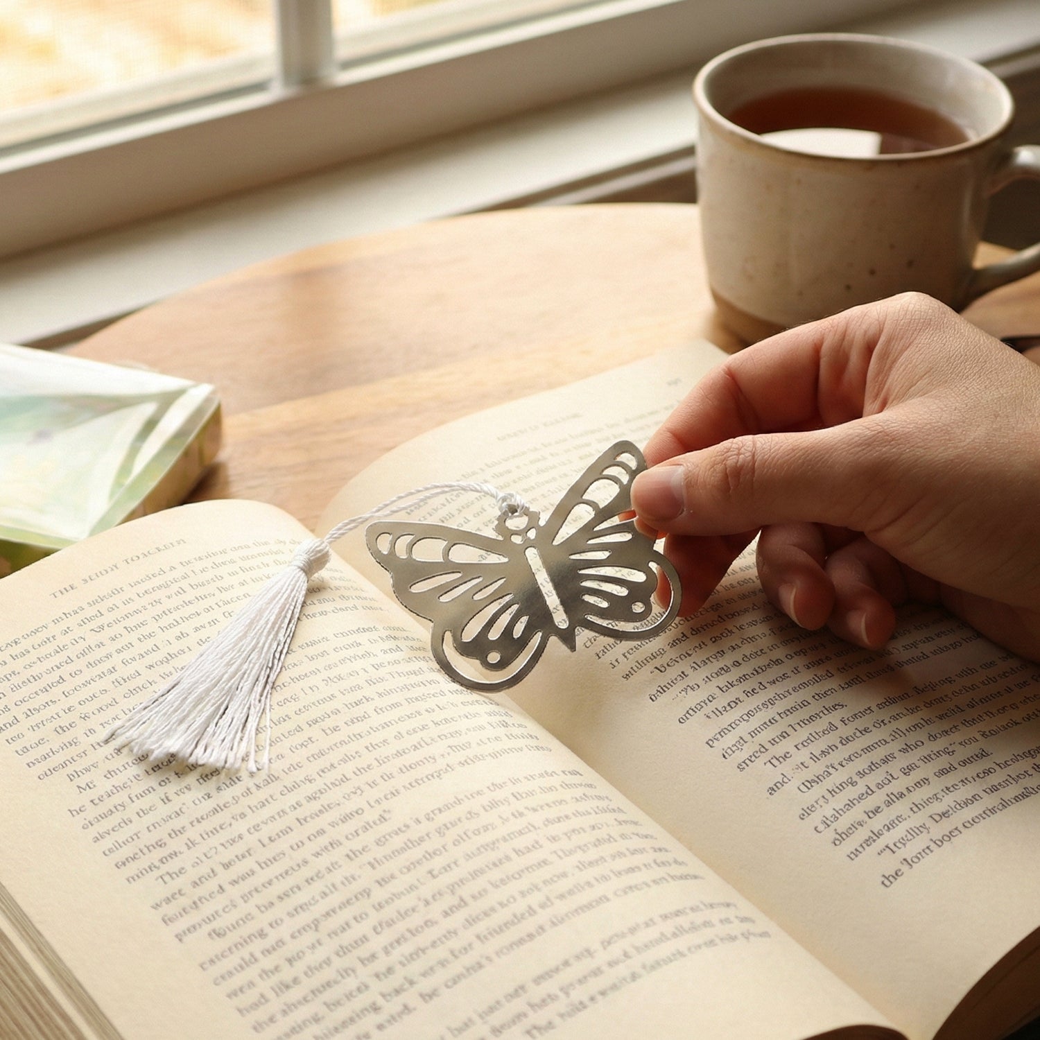 Metal butterfly bookmark lying flat highlighting delicate silhouette