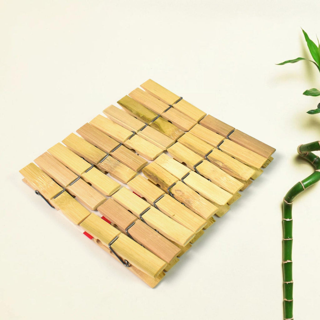 Strong bamboo cloth clips holding various garments on a clothesline, ideal for laundry.