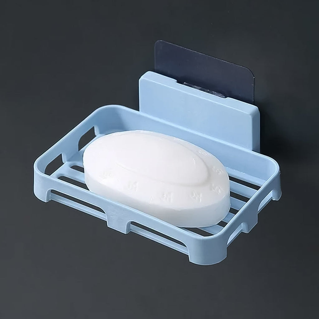 Plastic wall-mounted soap dish holding soap and sponge in a modern kitchen setting.