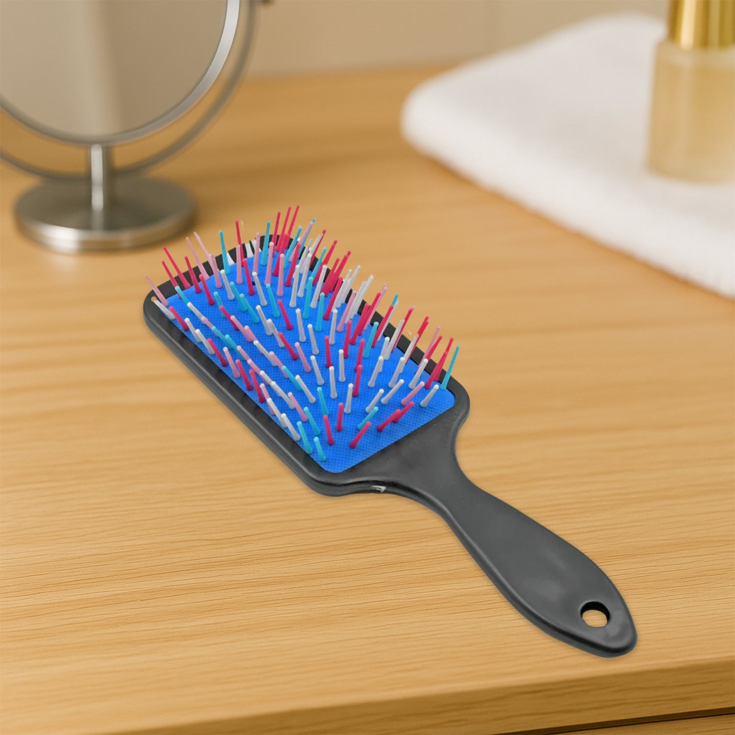 Close-up of the flexible, protective ball-tipped bristles of the hair growth comb.