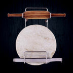 Elegant stainless steel stand securely holding a wooden rolling pin on a kitchen counter.