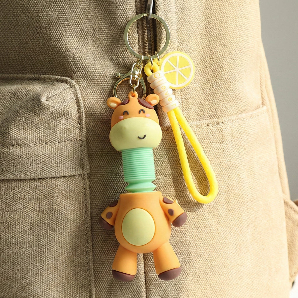 Close-up of giraffe cartoon keychain highlighting playful design