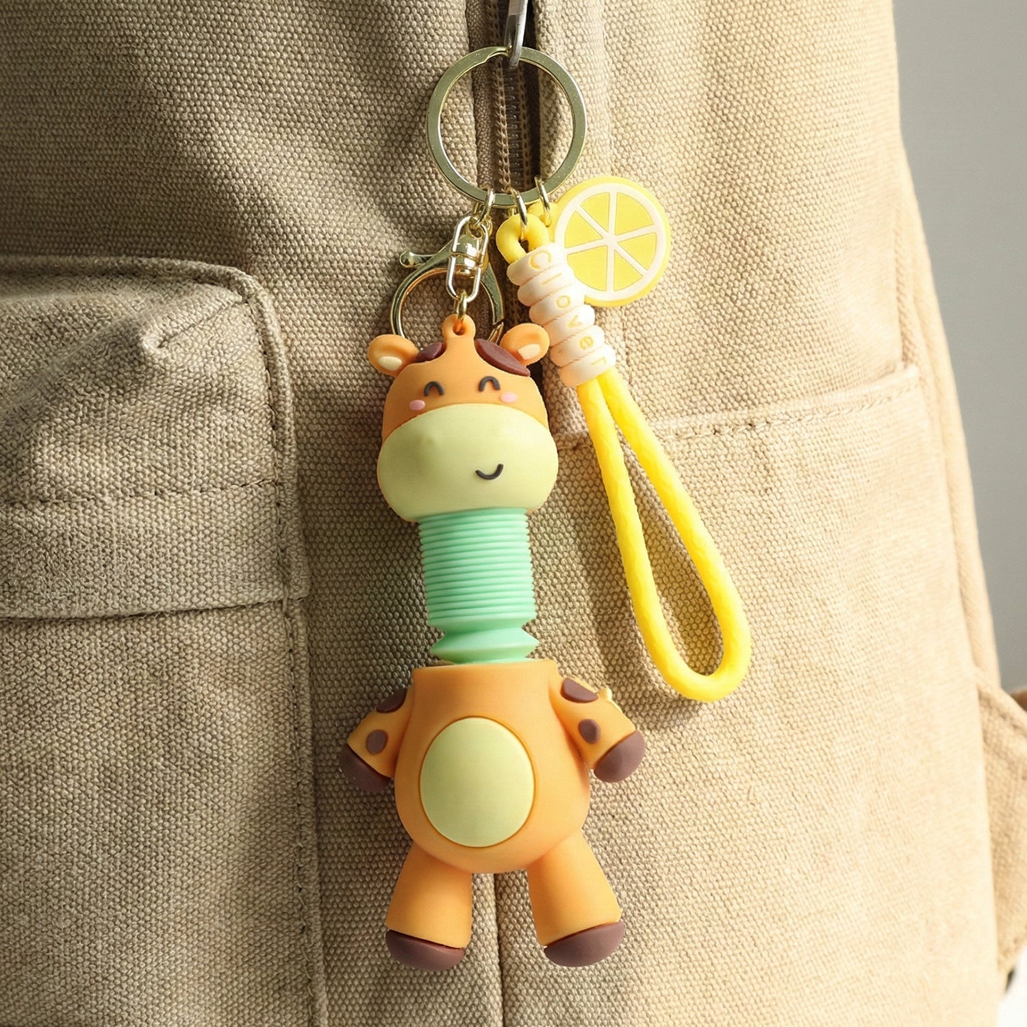 Close-up of giraffe cartoon keychain highlighting playful design