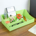 Office desk with green multi-slot organizer storage tray in use