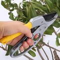 Pruning shears with sharp SK-5 steel blades and ergonomic handle for gardening