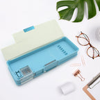 Two-compartment plastic stationery box, ideal for separating different types of school supplies.