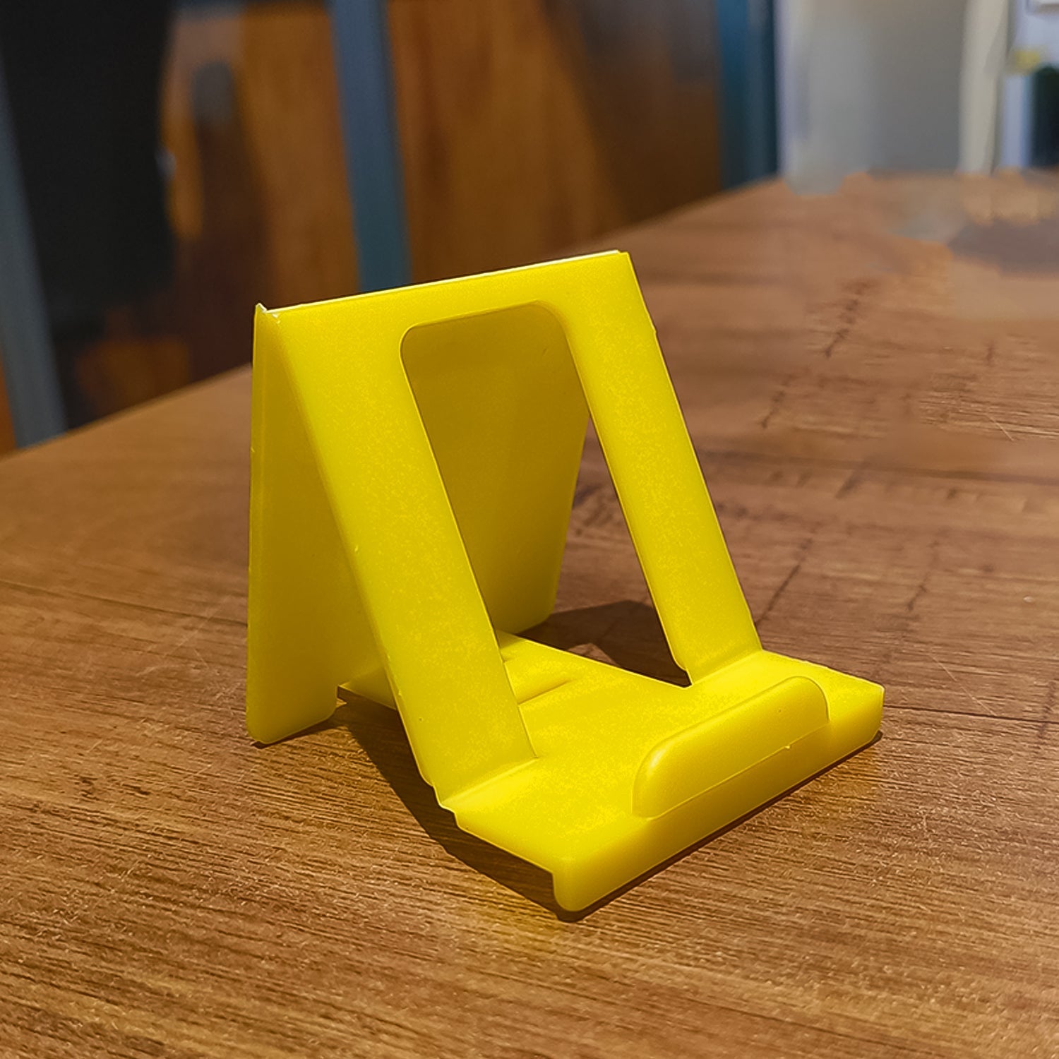 Smart tilt compact mobile phone holder in adjustable position