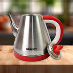 Pouring hot water from the Siplix electric kettle, ready for tea or coffee.