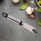 Close-up of the rotating peeler head with different stainless steel blade types