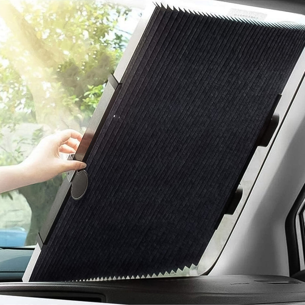 Driver installing the retractable car windshield sun shade with suction cups.