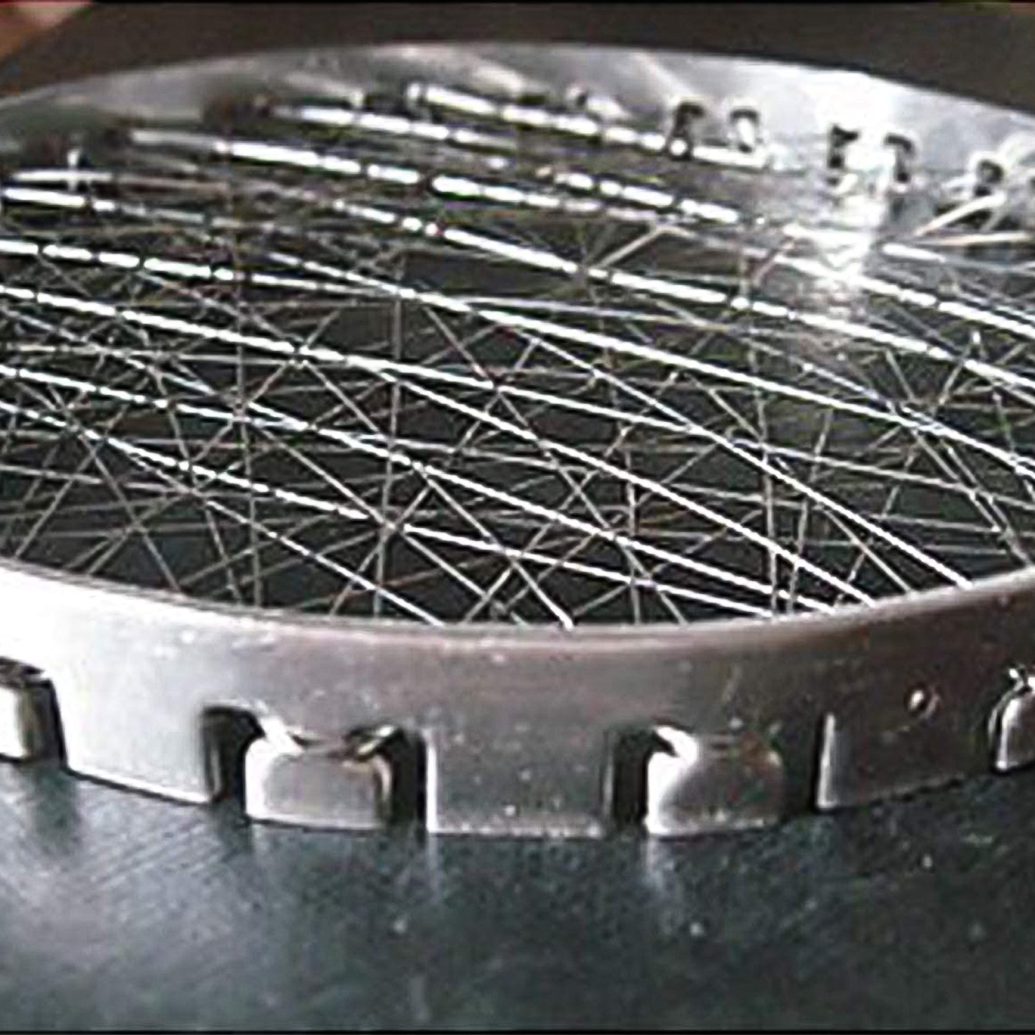 Front view of the Indo Glow stainless steel mini tandoor jalli, showcasing its design.