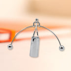 Elegant metal balance desk toy, a classic physics demonstration piece.