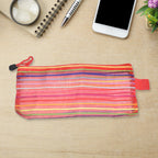 Flexible transparent mesh organizer pouch, ideal for storing small items.
