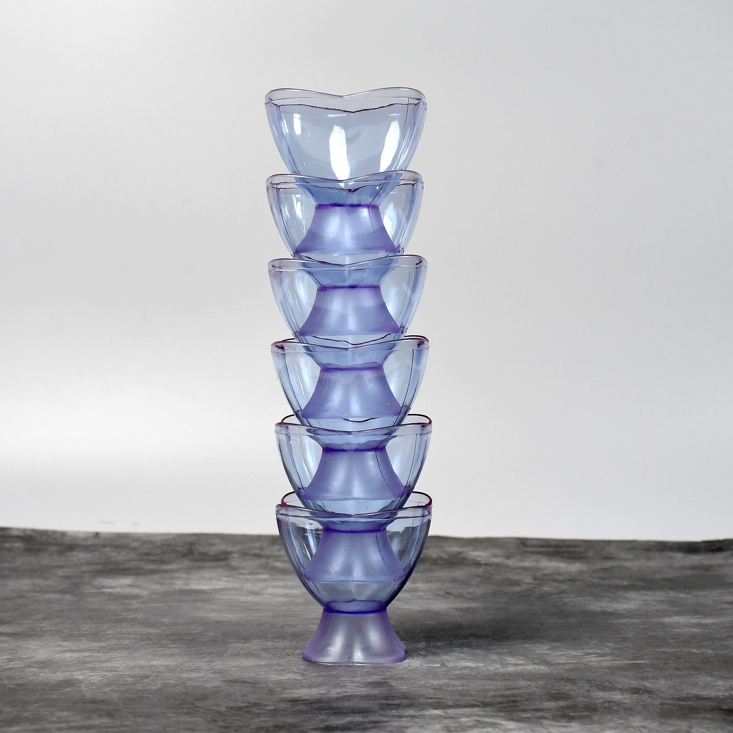 Clear plastic dessert bowls filled with delicious treats for home use.