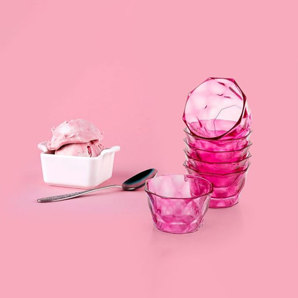 Six clear plastic diamond shape ice cream bowls arranged neatly.