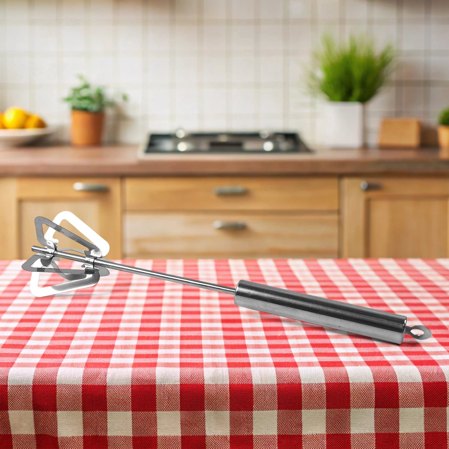 Konvex stainless steel hand push mixer actively whisking eggs in a bowl, demonstrating its efficient blending action.