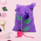 Unfolded reusable shopping bag featuring a vibrant rose design against a plain background.
