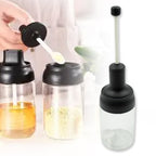The transparent glass body of the spice container, showing its contents clearly.
