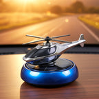 Solar helicopter car air freshener rotating on car dashboard in sunlight