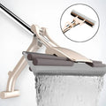 A person demonstrating the self-cleaning sponge mop with its bucket system for hands-free floor cleaning.