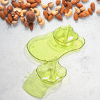 Side view of the versatile apple-shaped serving set for pickles and dips.