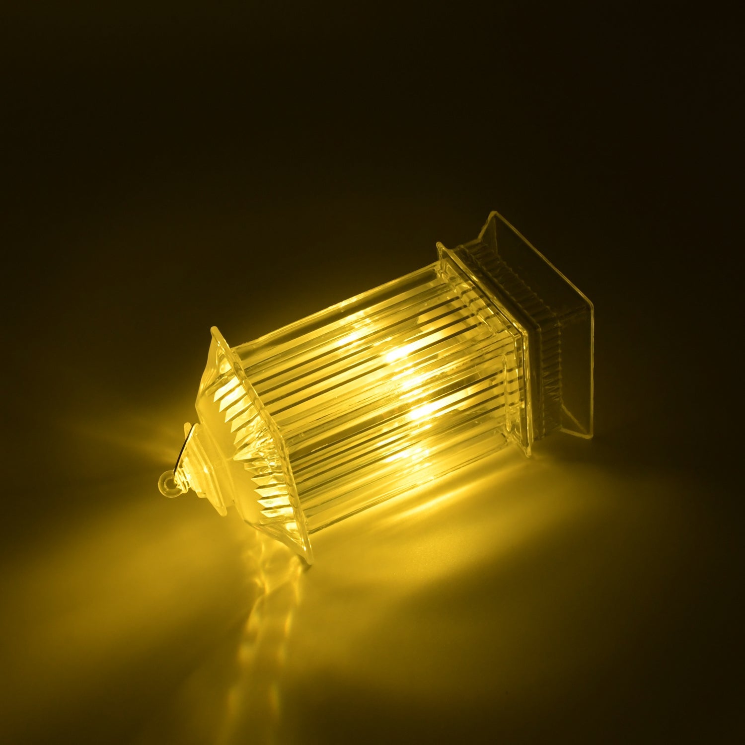 Close-up of the acrylic crystal table lamp with a warm flickering LED candle light.