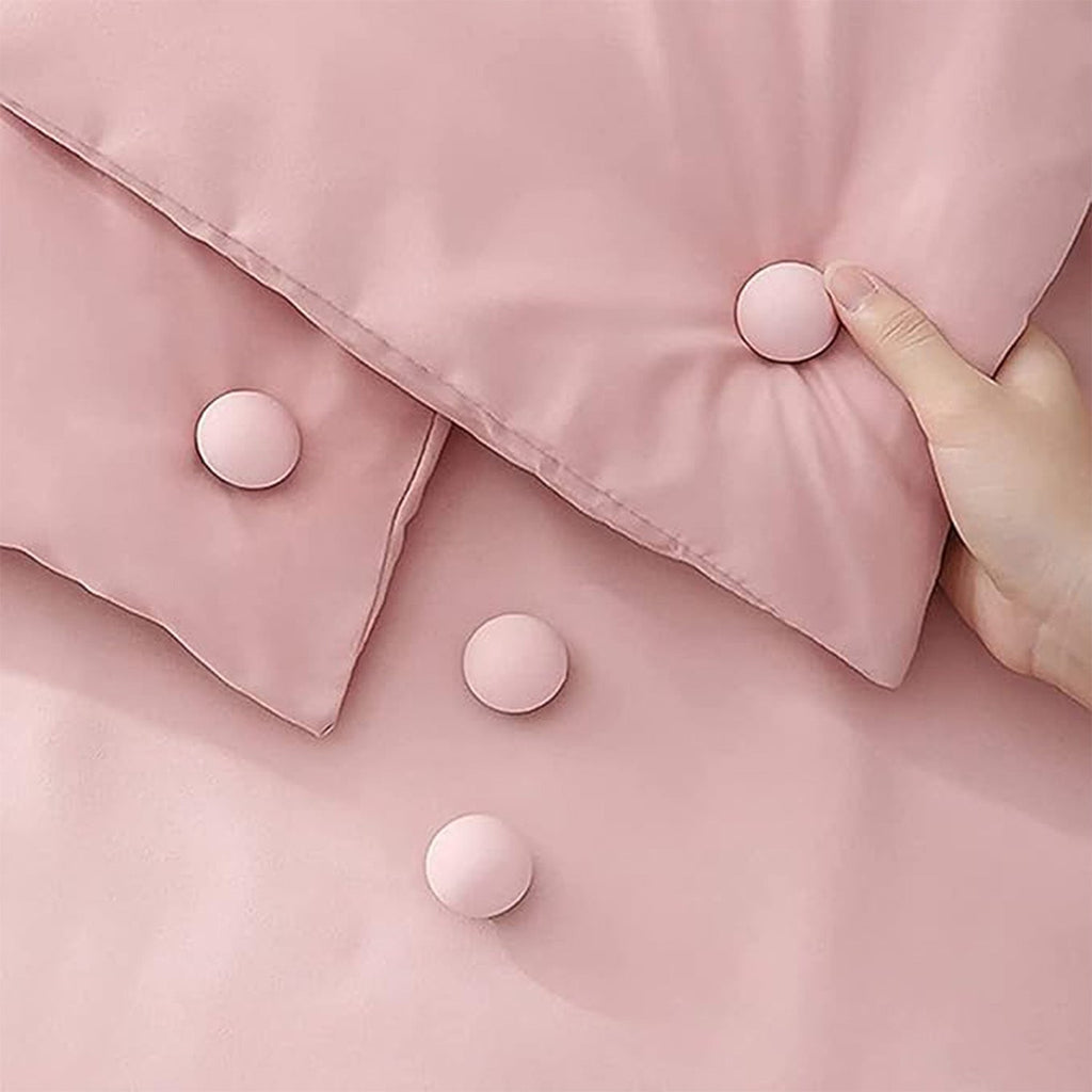 Eight mushroom-shaped fabric sofa pins arranged on white background