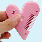Lightweight baby hair scissors held in hand, demonstrating ease of use.