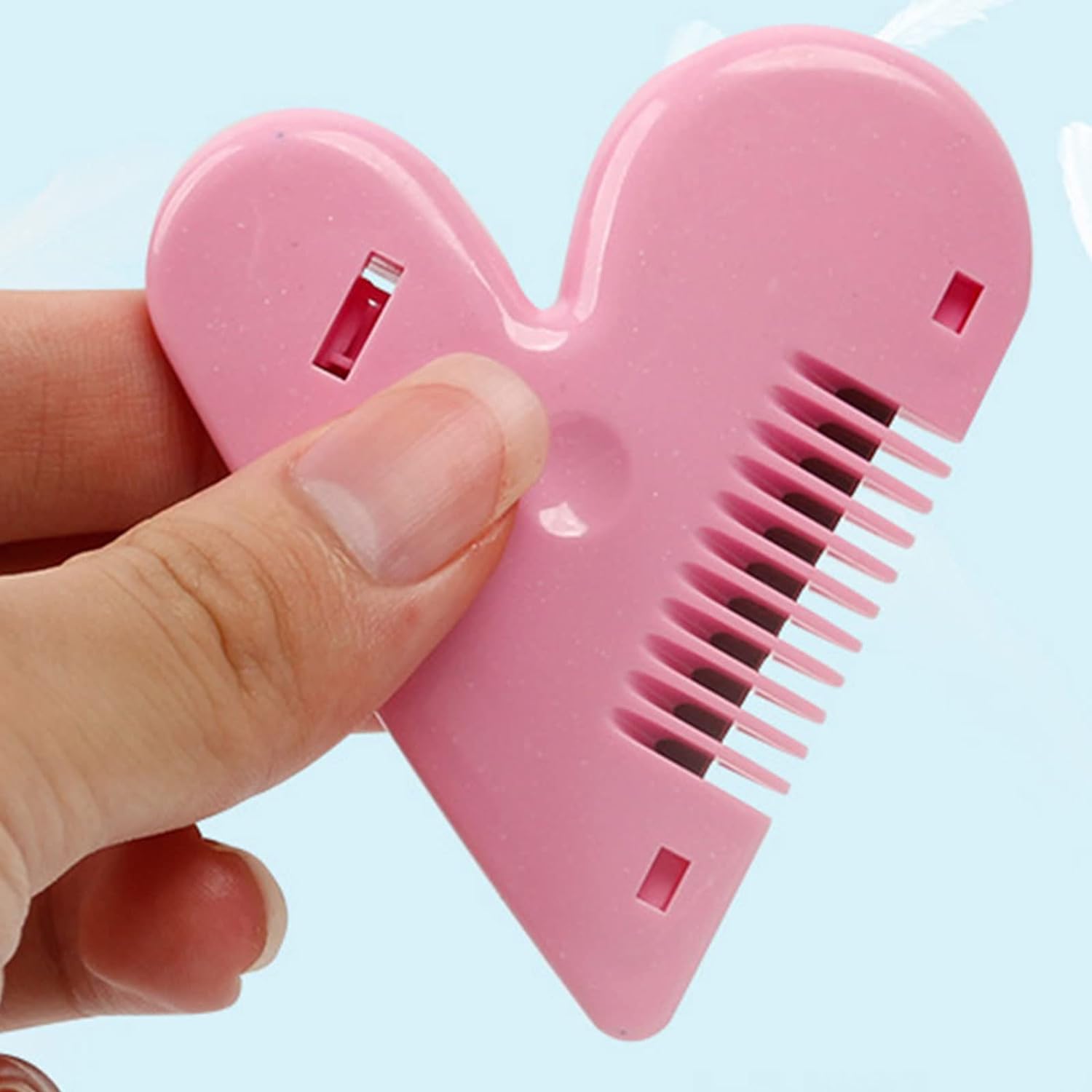 Lightweight baby hair scissors held in hand, demonstrating ease of use.
