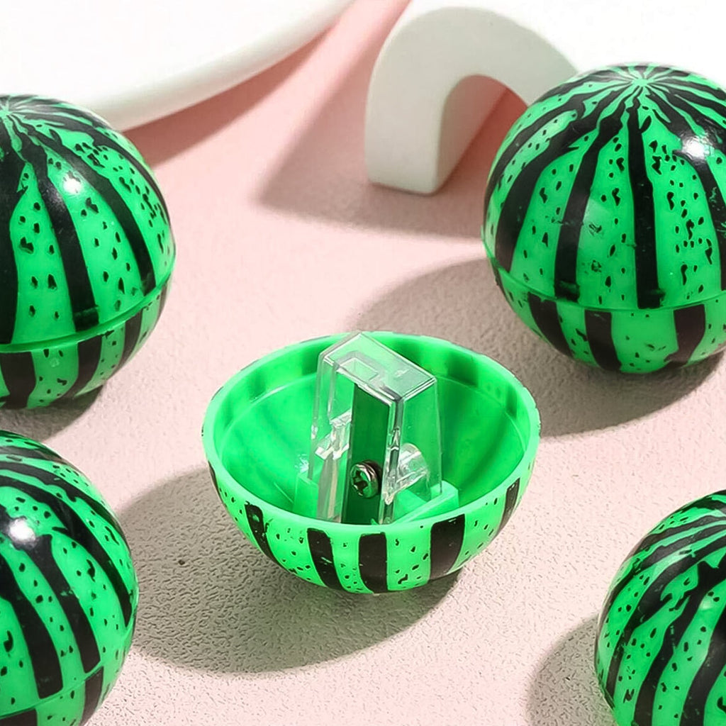 Child holding the watermelon pencil sharpener, a manual sharpener for kids