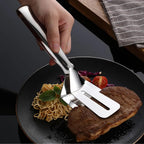 Ergonomic stainless steel kitchen tong holding grilled vegetables.
