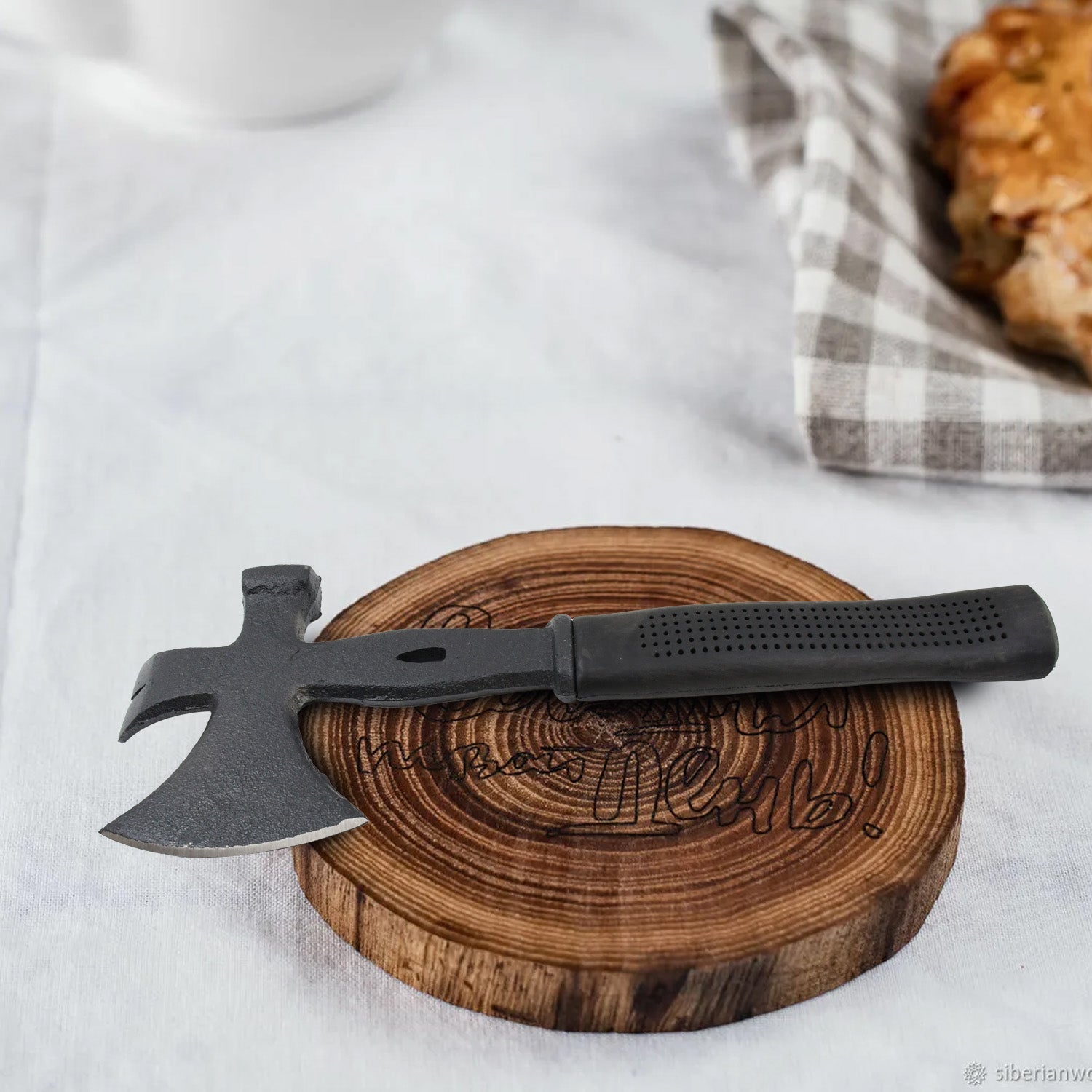 Detailed view of the robust die-cast steel construction of the multifunction axe.