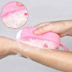 Double-sided silicone bath brush shown in use for a thorough skin cleanse.