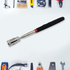 Portable magnetic grabber tool used to retrieve a dropped nut.