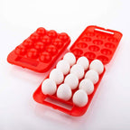 Open plastic egg carrier box showing 12 eggs securely nested inside.