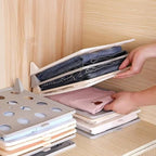 Wardrobe drawer with multiple Clothes Folding Boards neatly stacked, showcasing organized garments.