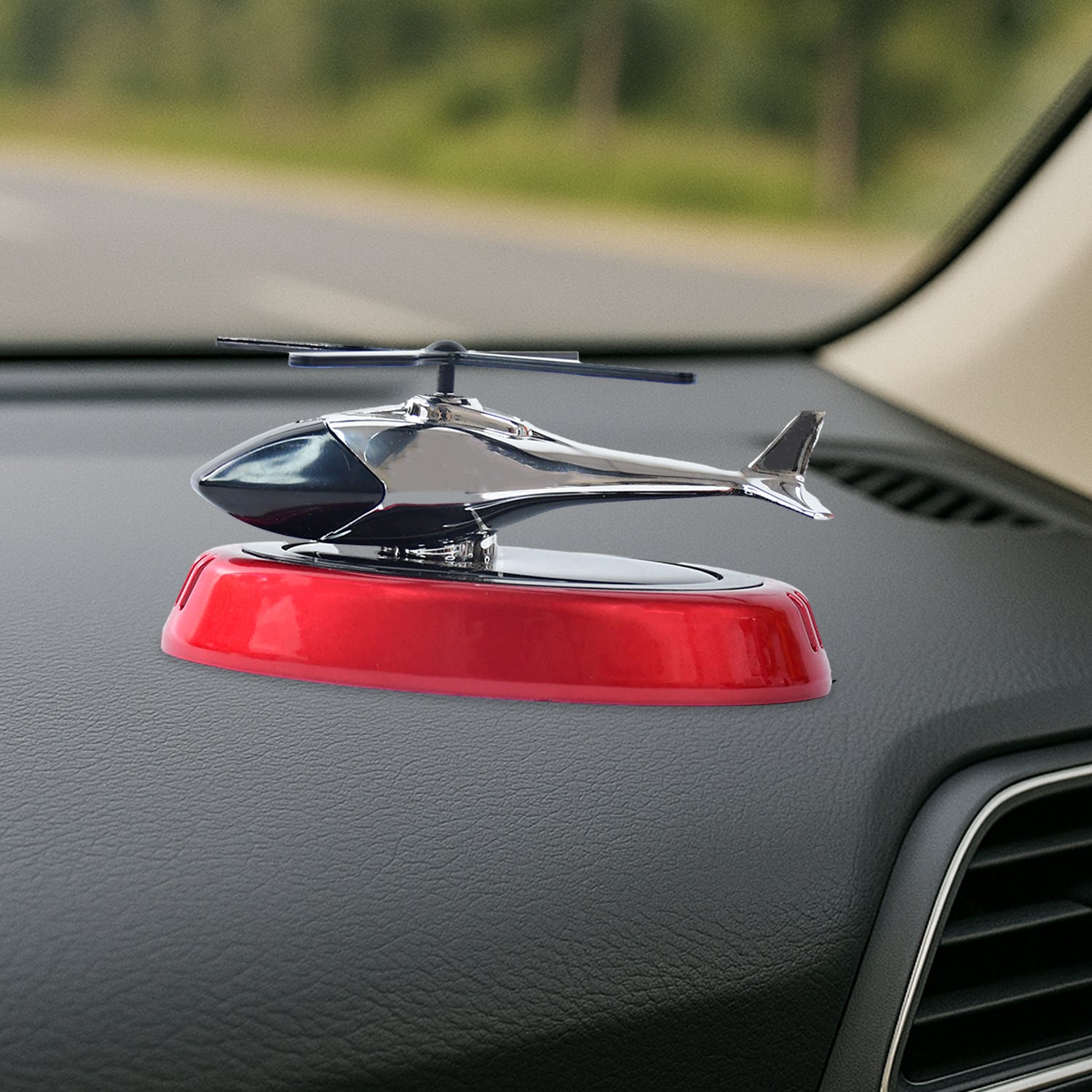 Side profile of solar-powered helicopter car diffuser on dashboard