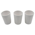 Multiple small plastic coffee and tea cups arranged for display.